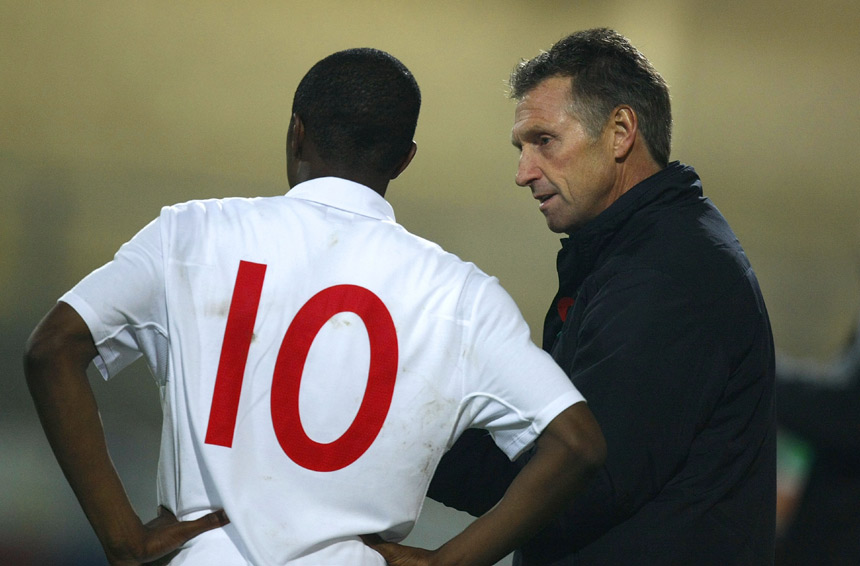 Kenny Swain relays some information to England forward, Matthias Fanimo